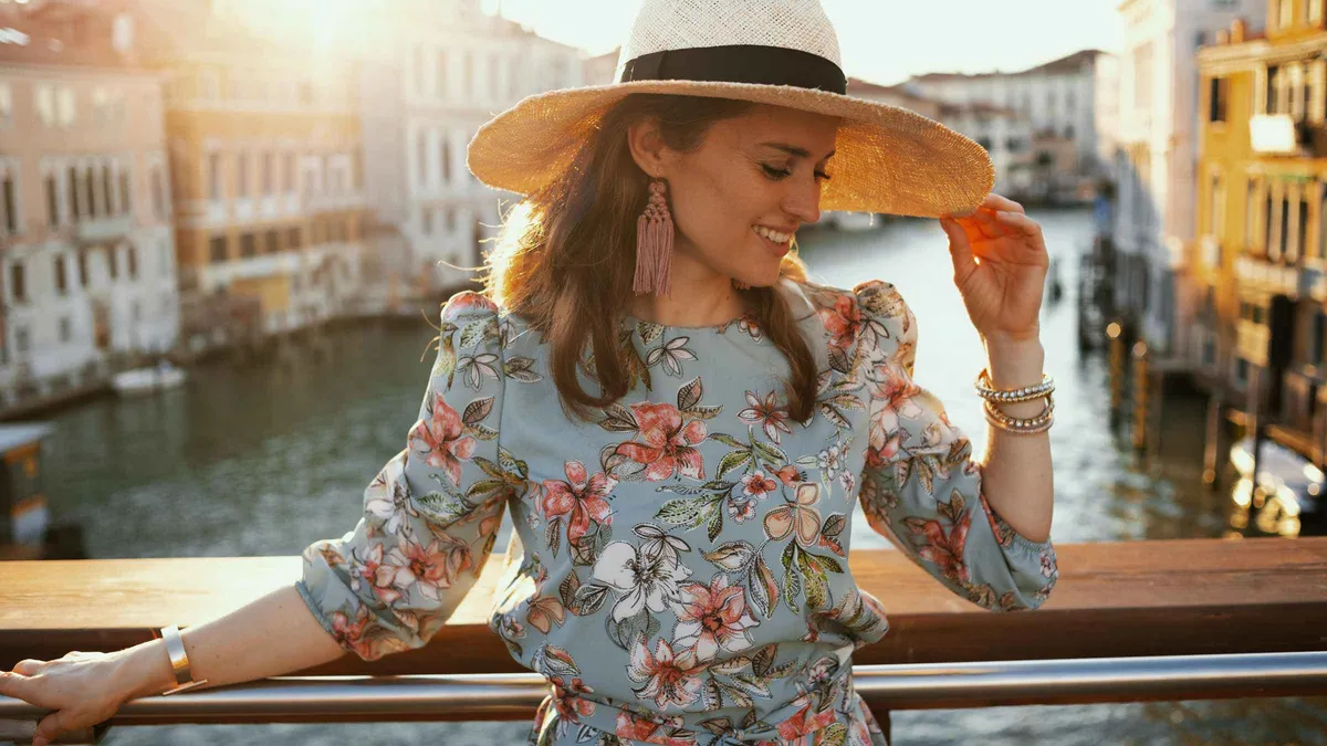 Photographer directing a group at Rialto Bridge during a grand canal photoshoot in Venice at morning light